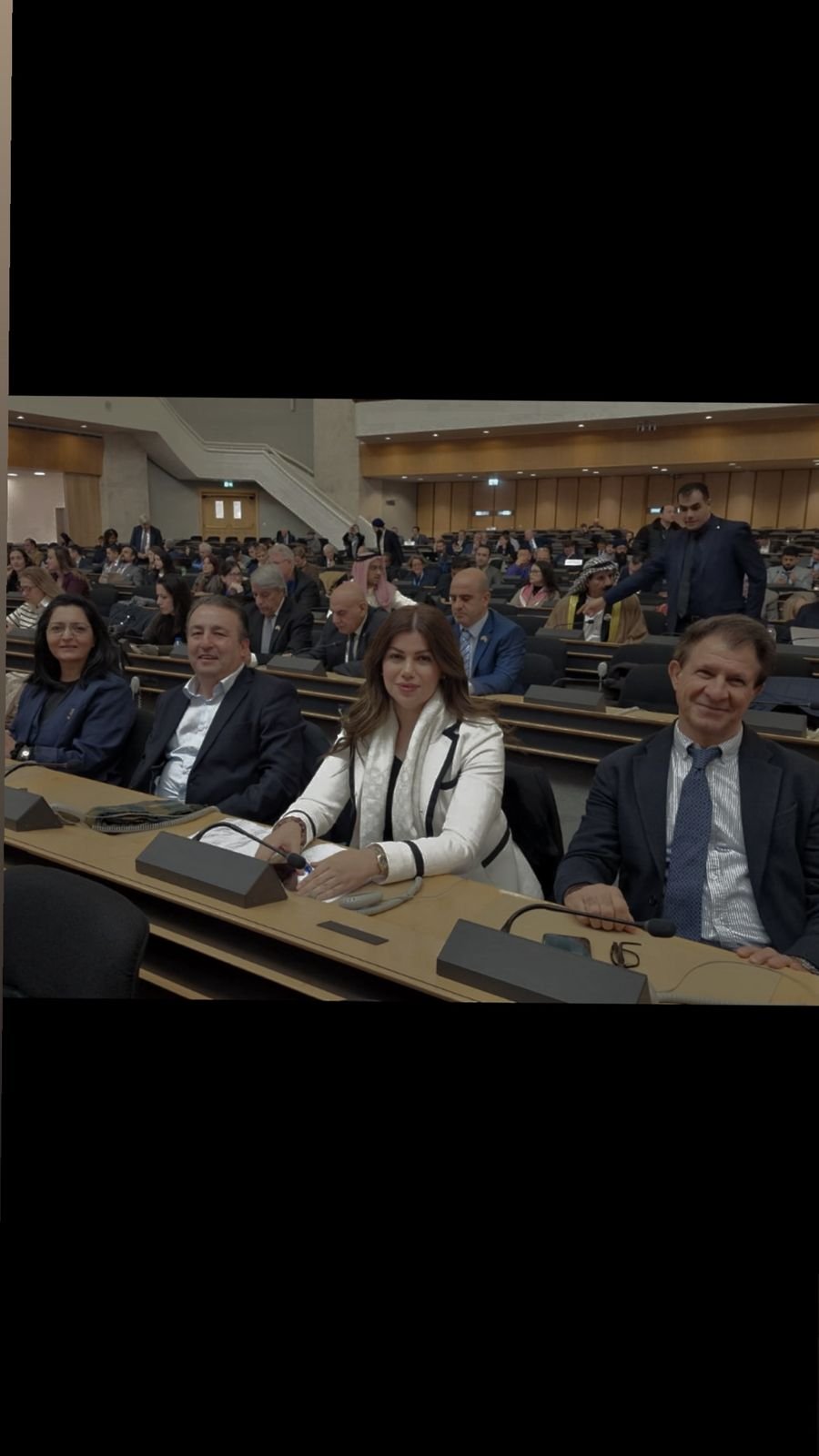 KIANO delegation seated among participants in a United Nations meeting room in Geneva
